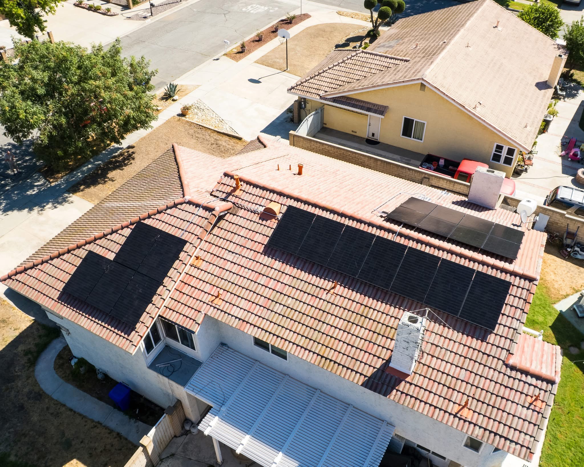 Aerial view of a California home with a rooftop solar array under a prepaid lease
